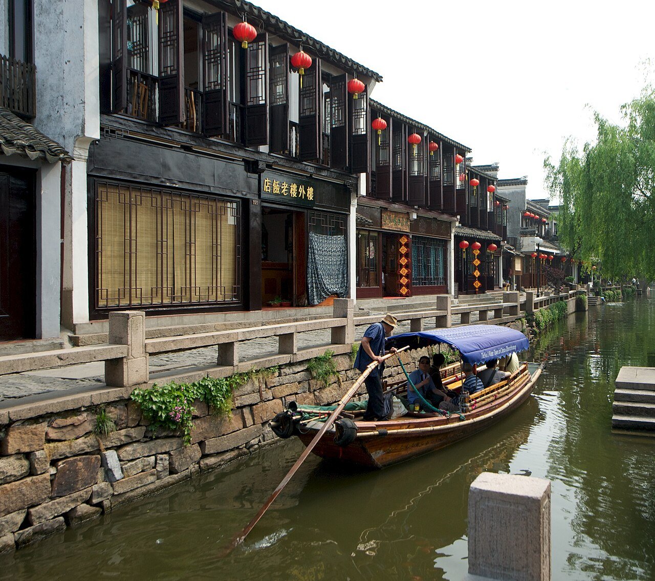 Sculling boat on a Jiangnan canal