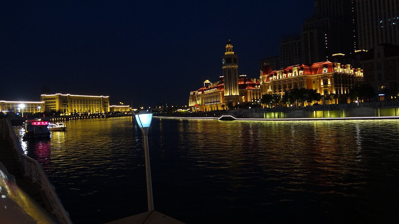 The Hai River in Tianjin at night, bridges lit up